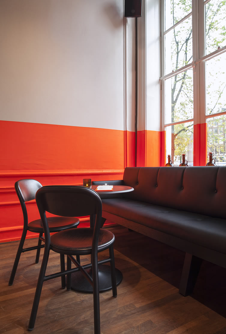 Orange paint and timber floor